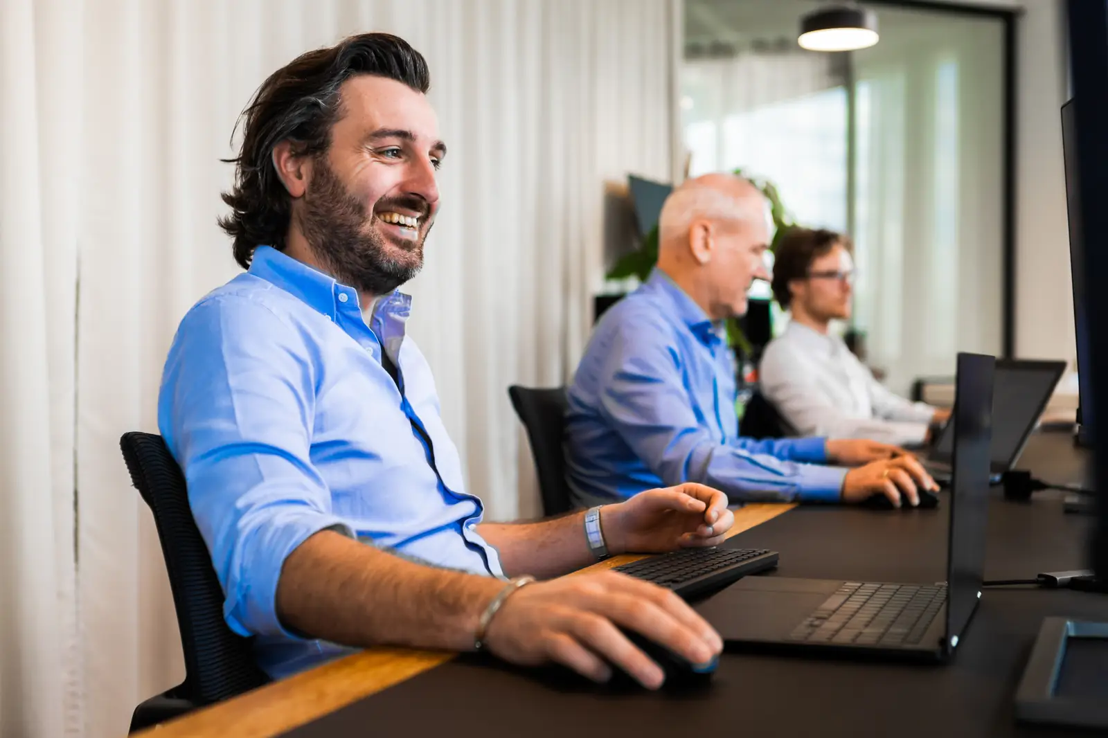 OBS Solutions consultants aan het werk op kantoor in Antwerpen
